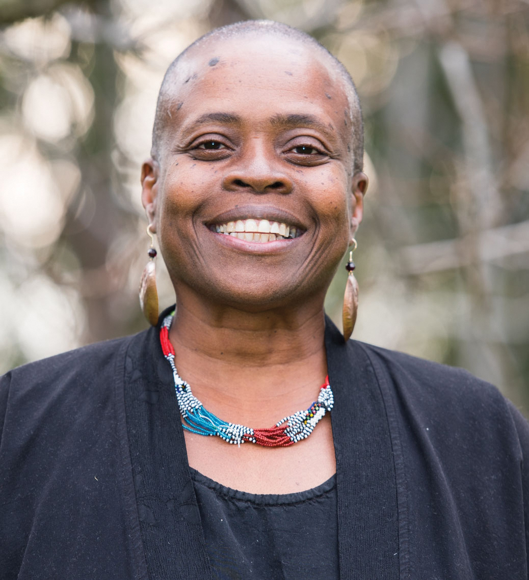 A portrait of Zenju Earthlyn Manuel smiling towards the camera